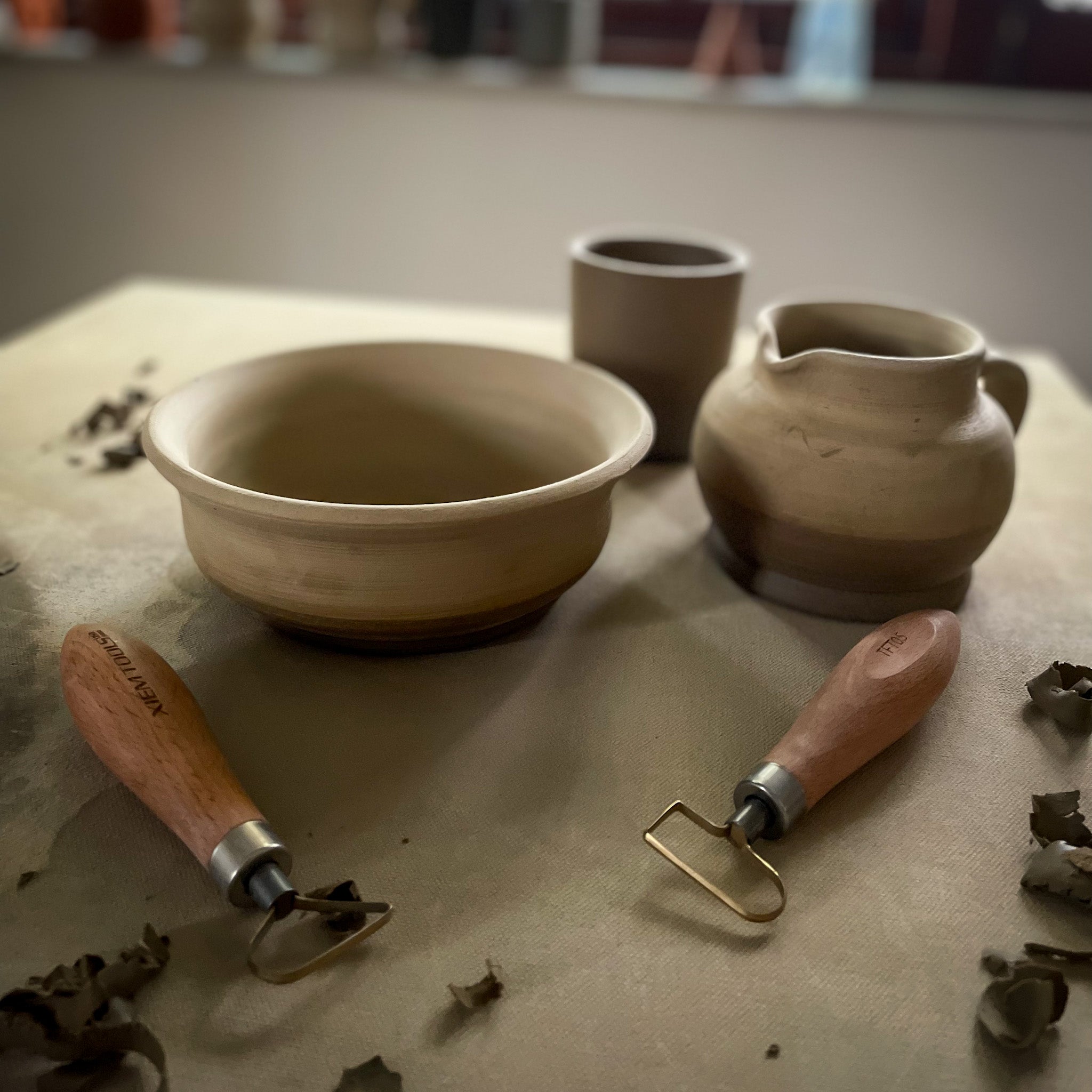 hand thrown trimmed pots in bone dry stage