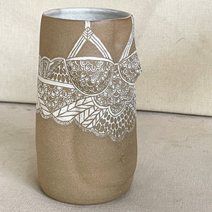 Brunnhilde Vase from Déesses de la nuit collection. Brown Body Stoneware Vase in the shape of the female form with sgraffito lacework done with white slip. Profile view